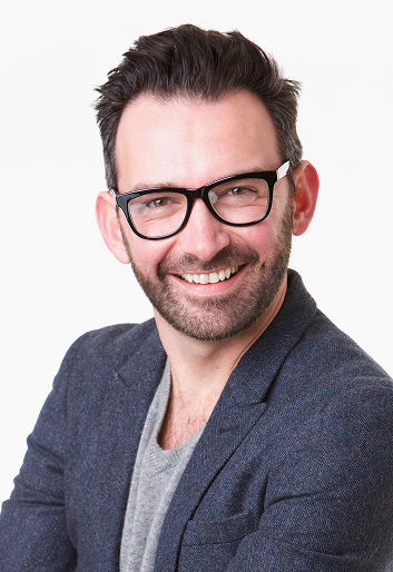 handsome-middle-age-man-with-glasses-posing-against-white-background 1