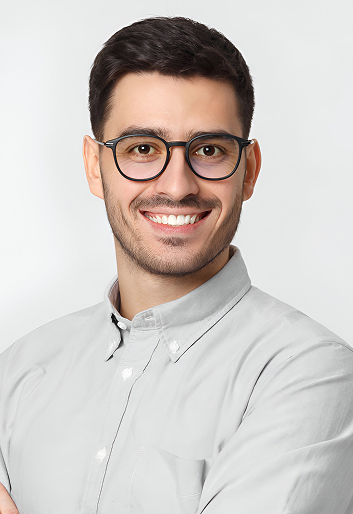 young-handsome-business-man-wearing-gray-shirt-eyeglasses-holding-arms-crossed-smiling-feeling-confident 1